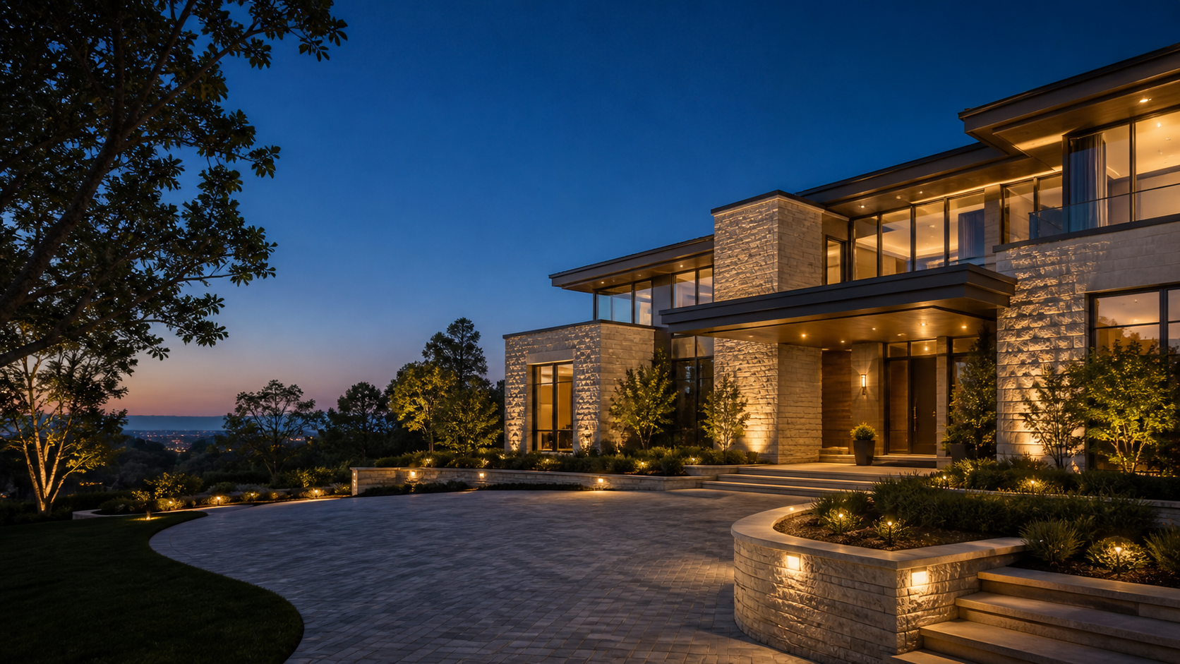 Modern luxury residence at dusk with warm architectural lighting